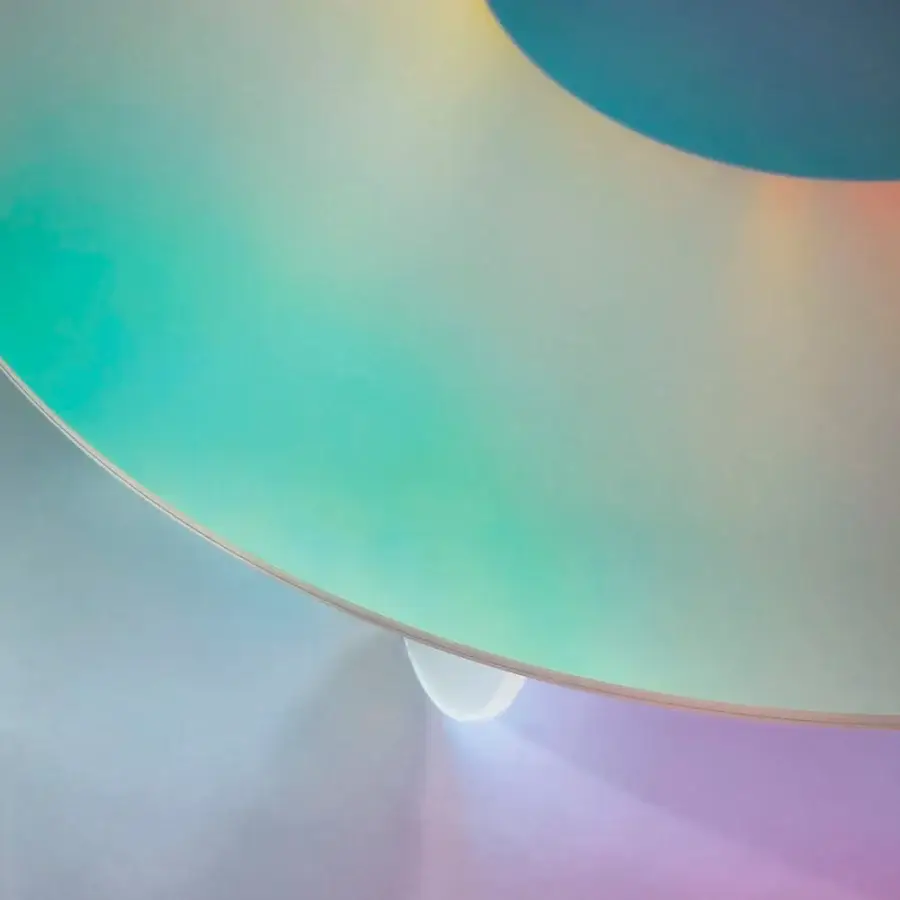 Exceptional Glas Italia Shimmer table crafted from laminated and glued glass with iridescent multichromatic finish shifting between teal, purple, and gold