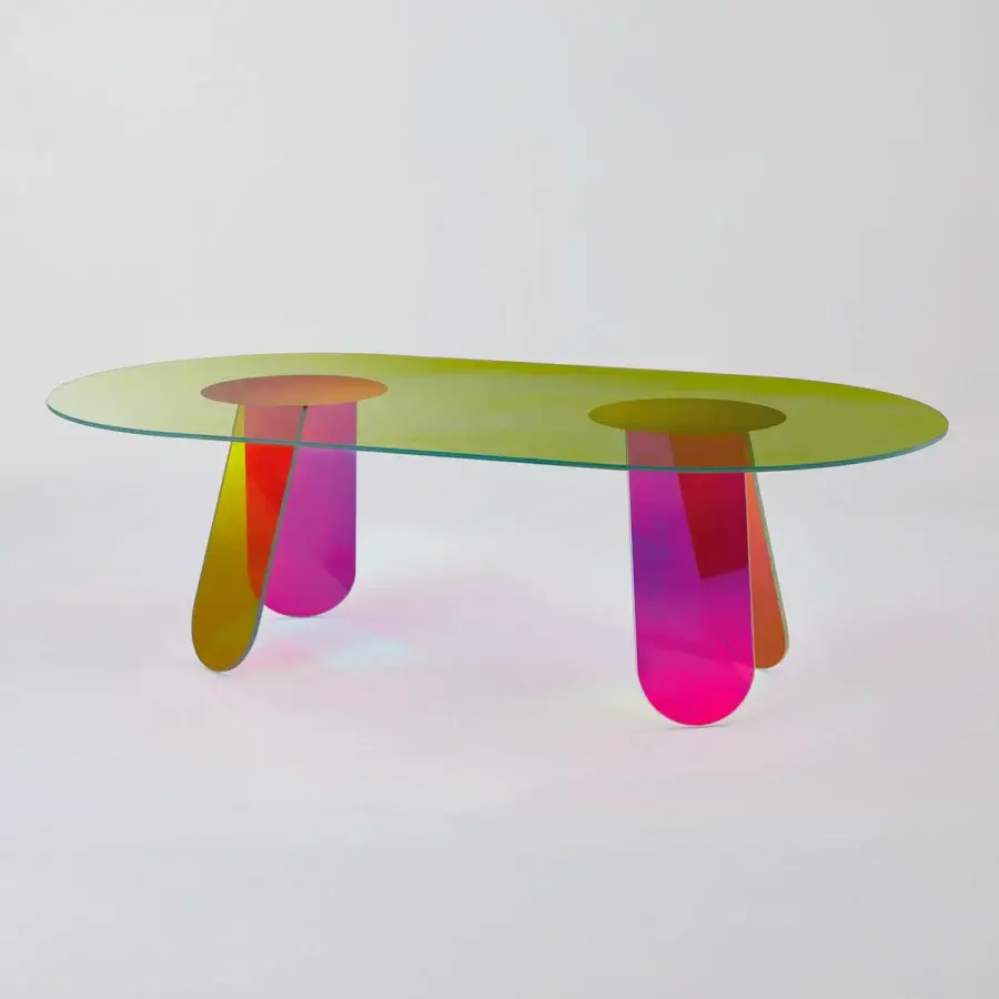 Elegant Glas Italia Shimmer table crafted from laminated and glued glass with iridescent multichromatic finish and organically sculpted legs transitioning from yellow to magenta