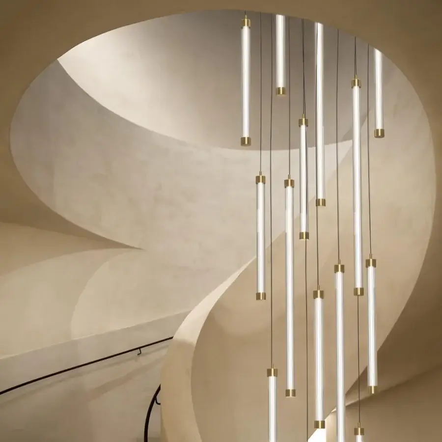 Elegant Euroluce Trama suspension lamp crafted in Italy with a slender glass tube and polished gold-toned metal accents