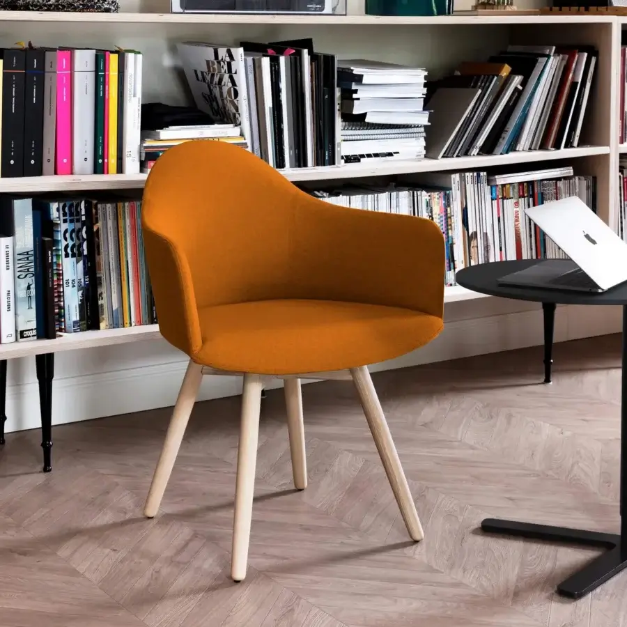 Distinguished Lapalma Edit armchair with a rigid Baydur® shell upholstered in golden-yellow textile and splayed solid ash legs with a varnished finish