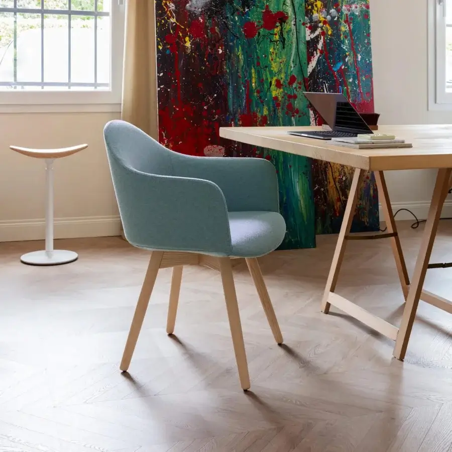 Elegant Lapalma Edit armchair with gently curved silhouette upholstered in muted blue-grey textile and varnished solid ash frame