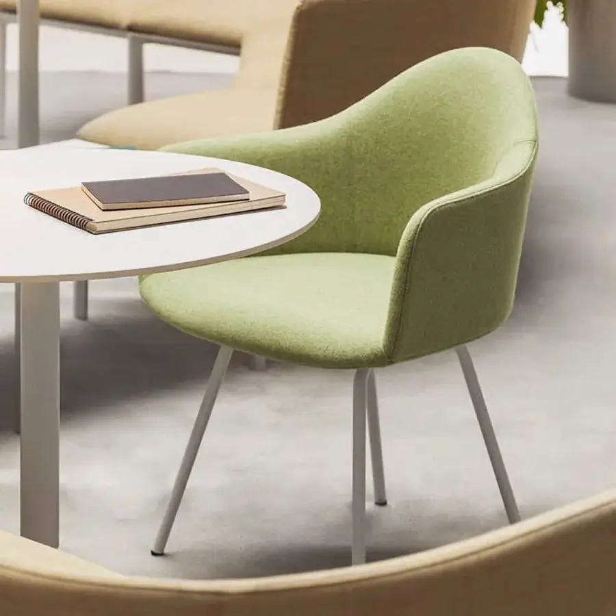 Superior Lapalma Edit armchair with rounded organic form upholstered in light green textile and satin light gray powder-coated steel base
