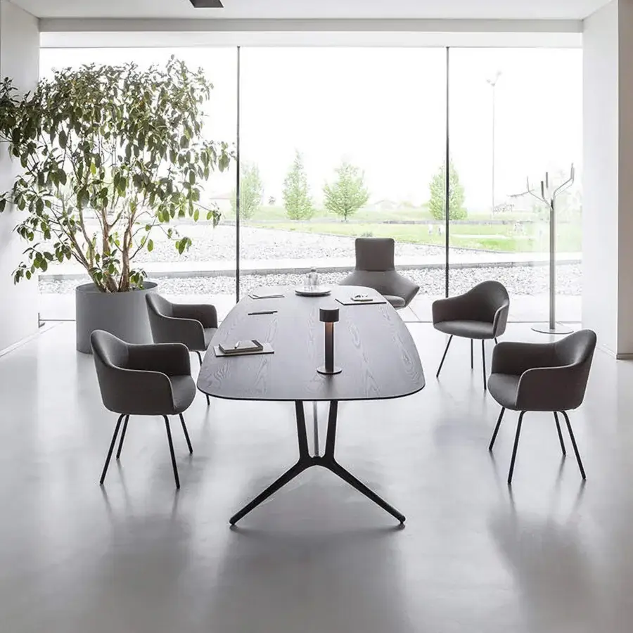 Elegant Lapalma Edit armchair with rounded organic form upholstered in neutral gray textile and matte black powder-coated steel base