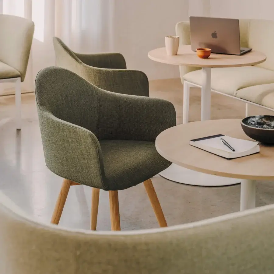 Distinguished Lapalma Edit armchair with gently curved form upholstered in textured olive green fabric and varnished solid ash legs