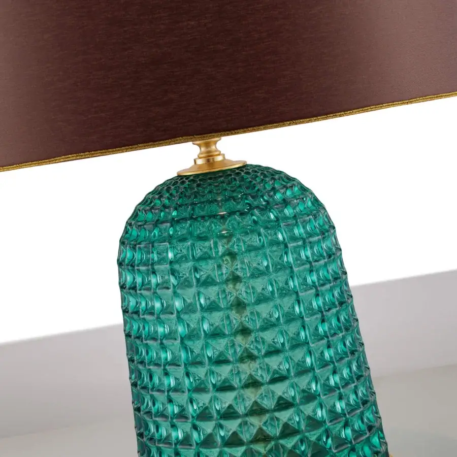Elegant Euroluce Cloche table lamp with handcrafted textured glass and golden-toned metal accents in deep teal
