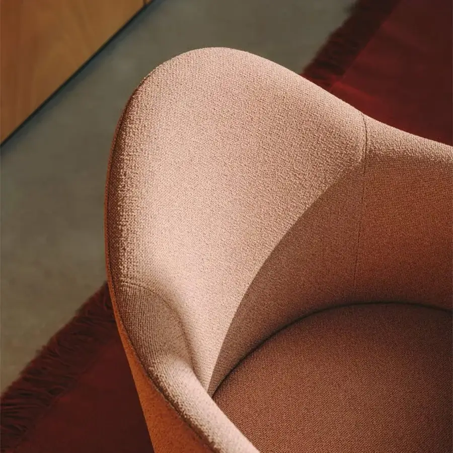 Captivating Lapalma Edit armchair in muted rose textured textile with white powder-coated aluminium swivel base
