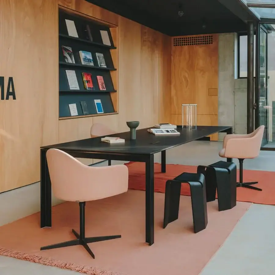 Exclusive Lapalma Edit armchair in dusty rose with a black powder-coated aluminium swivel base crafted in Italy