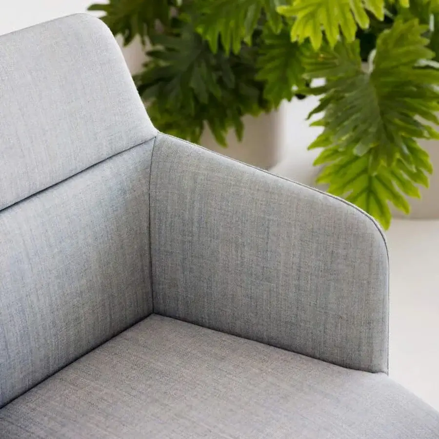 Distinguished Lapalma Foil armchair upholstered in subtly textured light blue-grey fabric with a solid ash wood base and natural finish