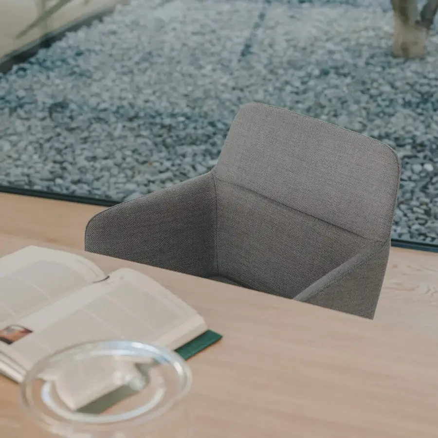 Elegant Lapalma Foil armchair upholstered in textured neutral gray fabric with a powder-coated aluminum swivel base