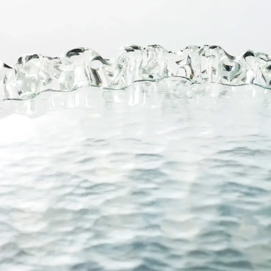 Distinguished Glas Italia Fountain Murano table crafted in clear glass with pale blue tones and glossy finish