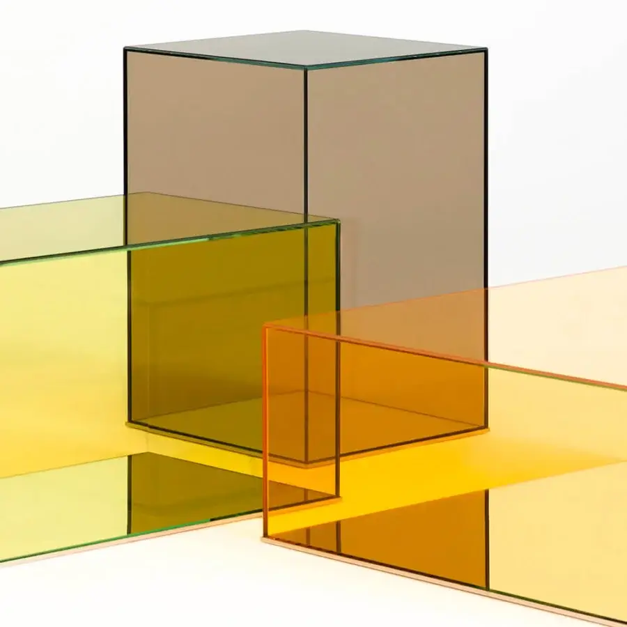 Sophisticated Glas Italia Donald table built in laminated amber and yellow glass with mirrored stainless steel base