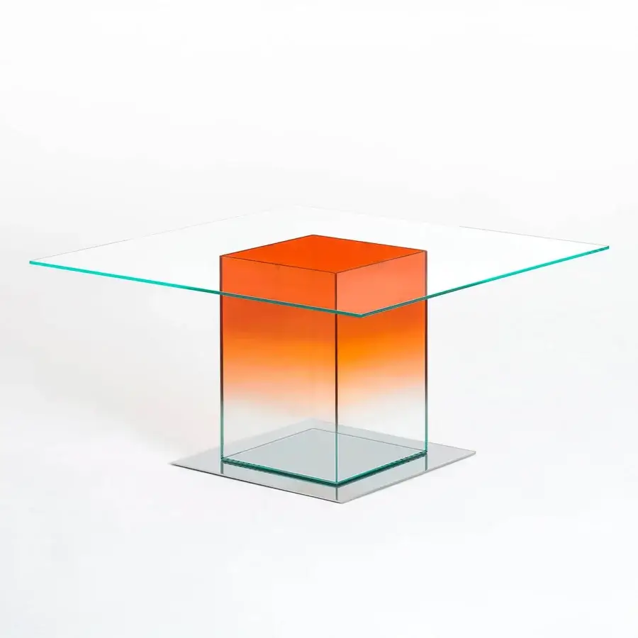 Superior Glas Italia Donald table crafted in laminated extralight glass and mirror-polished stainless steel with an orange gradient finish