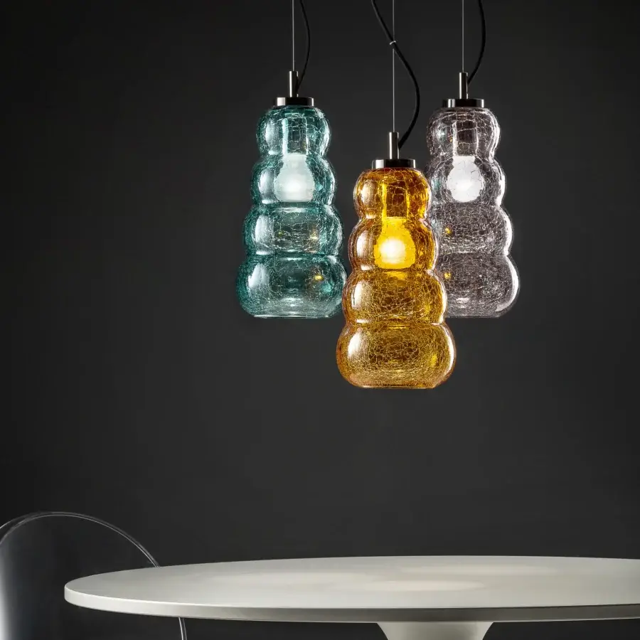 Distinguished Euroluce Vogue suspension lamp crafted in teal blue blown glass with a refined cracklè effect and dark metallic cap