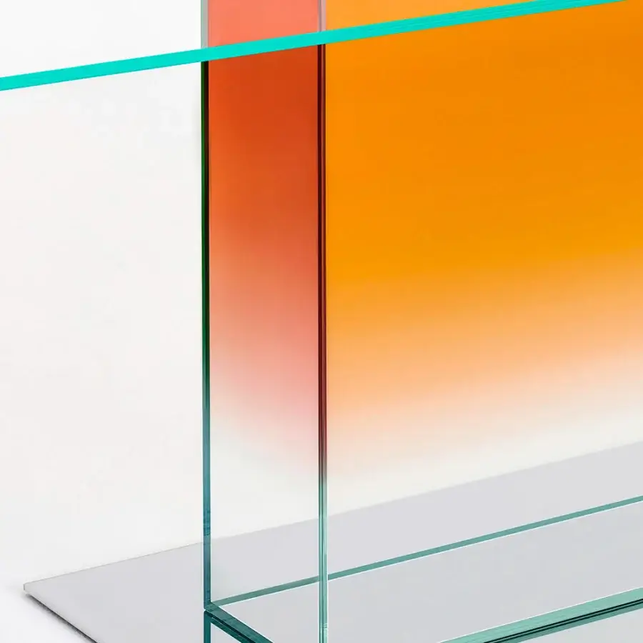 Exceptional Glas Italia Donald table with yellow-green to reddish-orange laminated extralight glass and mirror-polished stainless steel base