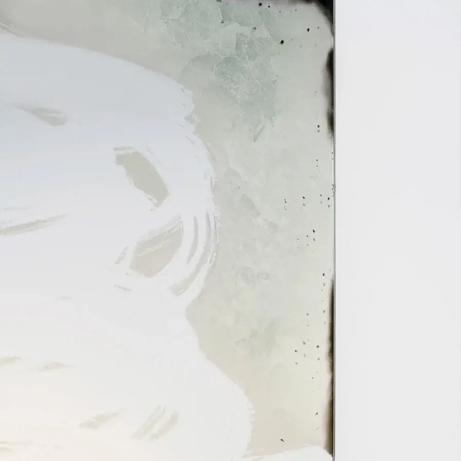 Exceptional Glas Italia Scribble mirror crafted from extralight glass with a pale gray and off-white mottled surface and dark metal border