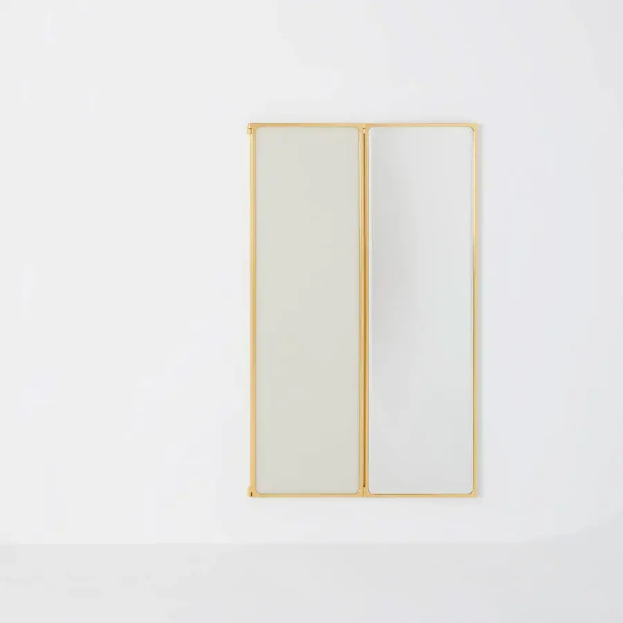 Distinguished Glas Italia Como mirror crafted in shiny-polished untreated solid brass with a satin finish and elongated reflective panels