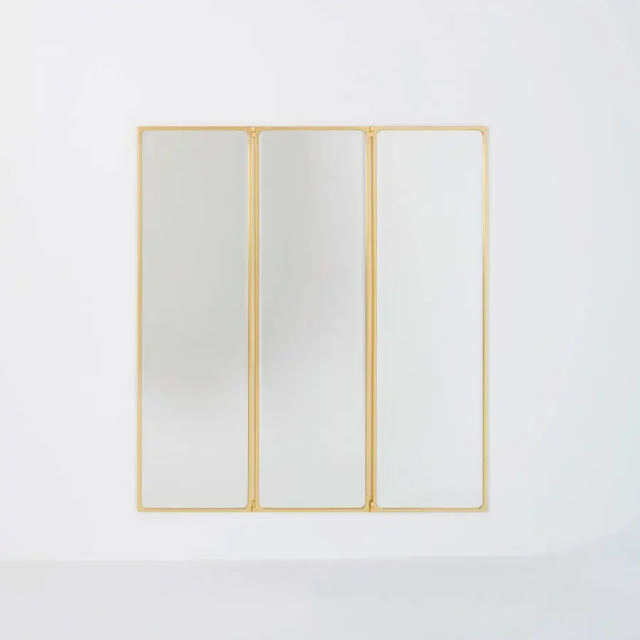 Exclusive Glas Italia Como mirror crafted in shiny-polished untreated solid brass with rotating three-panel design