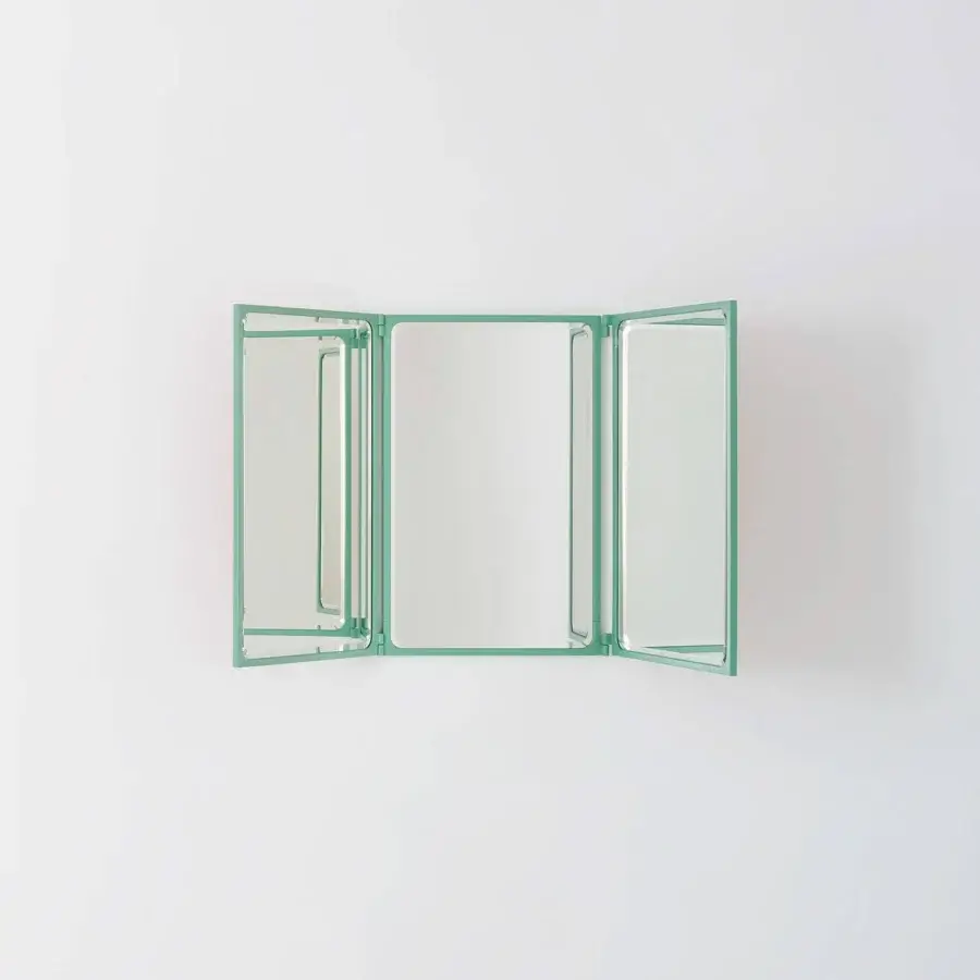 Elegant Glas Italia Como mirror crafted in shiny-polished untreated solid brass with rotating panels and matte teal finish