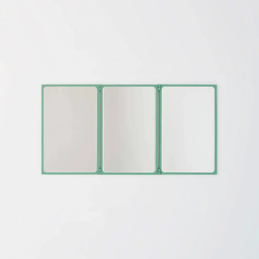 Distinguished Glas Italia Como mirror crafted in teal-hued solid brass with a matte finish and rotating hinged panels