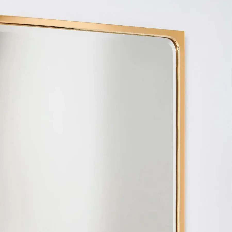 Superior Glas Italia Como mirror crafted in shiny-polished untreated solid brass exhibiting a minimalist rectangular form with a subtle bevel