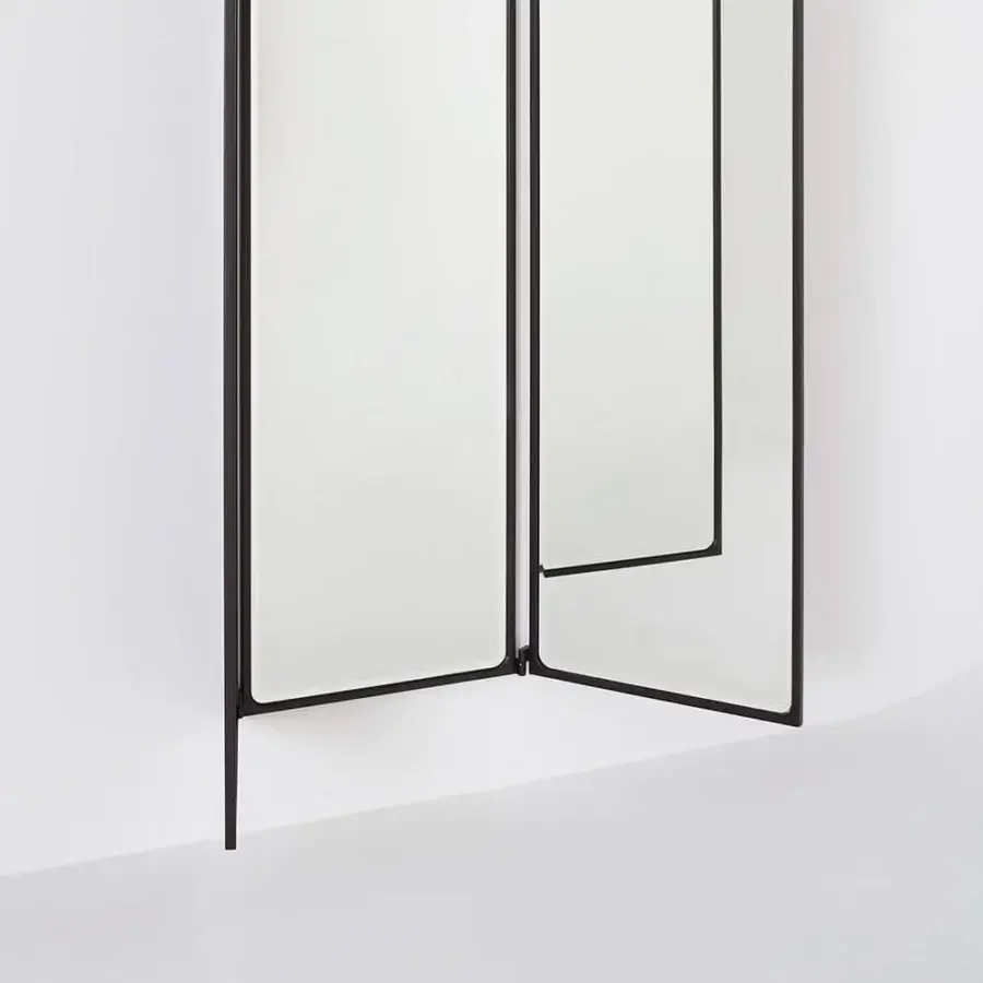 Exceptional Glas Italia Como mirror crafted in shiny-polished untreated solid brass with a striking black finish and rotating panels