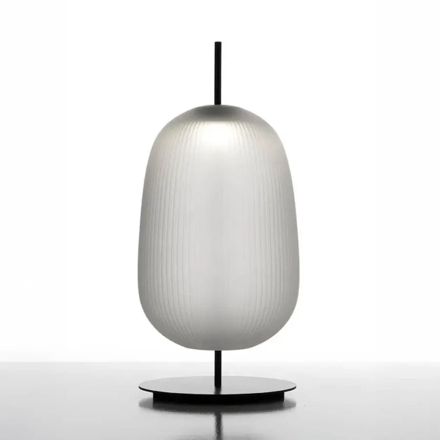 Innovative melogranoblu Maat table lamp crafted in hand-blown frosted glass with a vertically ribbed texture and dark metal support