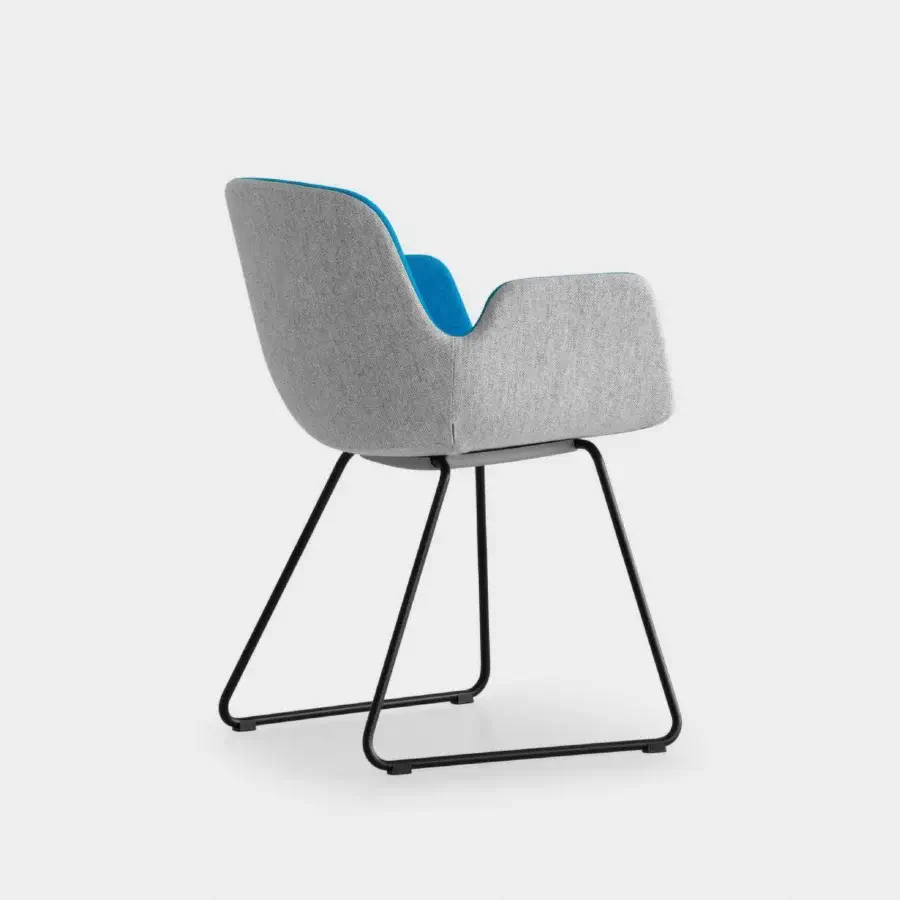 Luxury Lapalma Pass armchair with fully padded gentle curves upholstered in textured neutral gray and bright blue accents with a sleek dark metal sled base