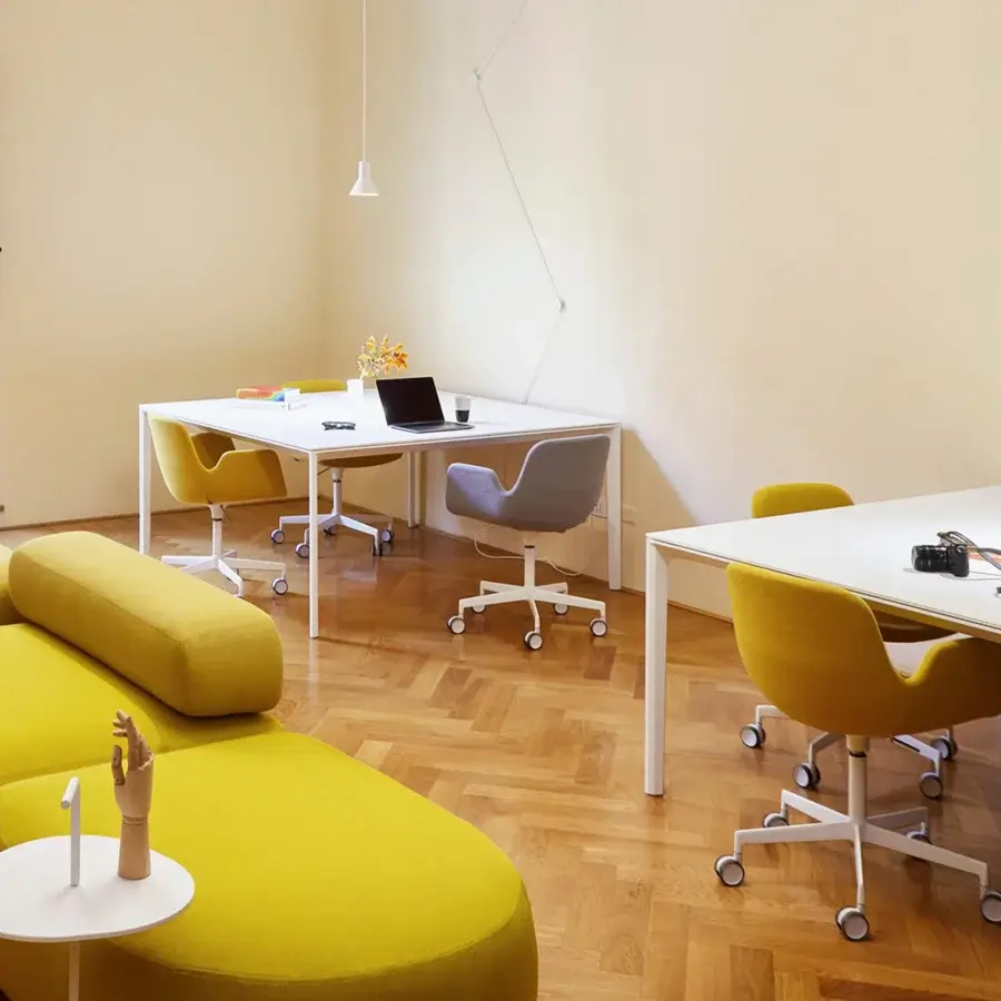 Superior Lapalma Pass Office armchair with sculpted form upholstered in vibrant yellow fabric and sandblasted aluminum base