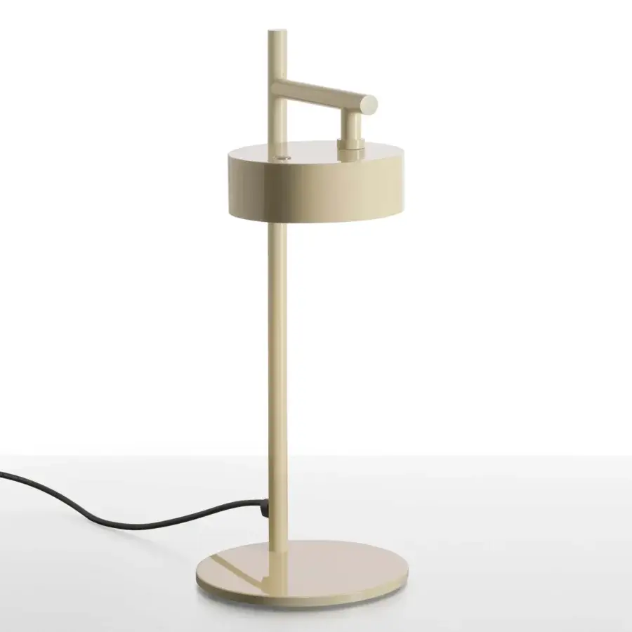 Elegant Oluce Berlin-Out lamp crafted in beige metal with a smooth matte finish, exhibiting a cylindrical silhouette and rotatable arm