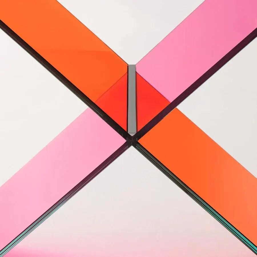 Superior Glas Italia XX console crafted in transparent pink and orange laminated glass with polished chrome metal accents