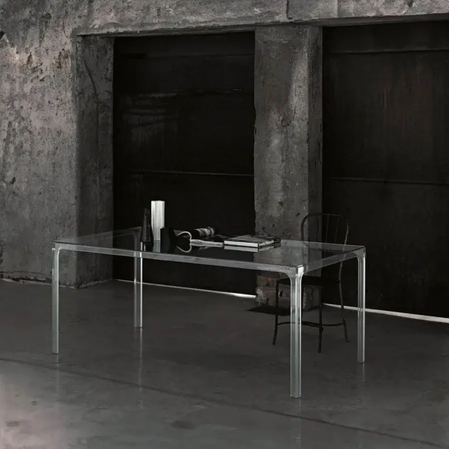 Exceptional Glas Italia Oscar table with transparent tempered glass and light-colored metal supporting a glossy finish