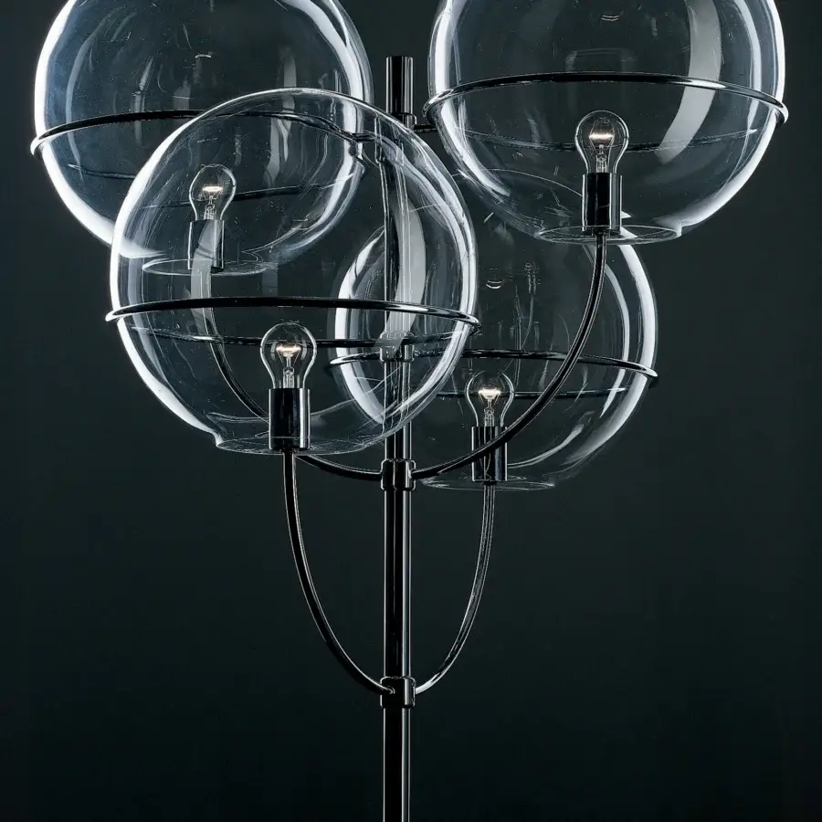 Superior Oluce Lyndon floor lamp with a sleek black metal frame and four luminous transparent polycarbonate spheres