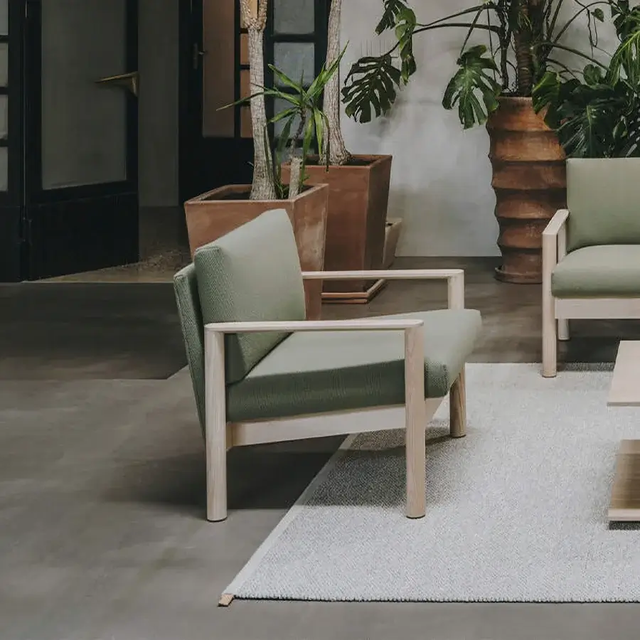 Sophisticated Lapalma 10:30 lounge chair with muted green textured textile and a solid ash base