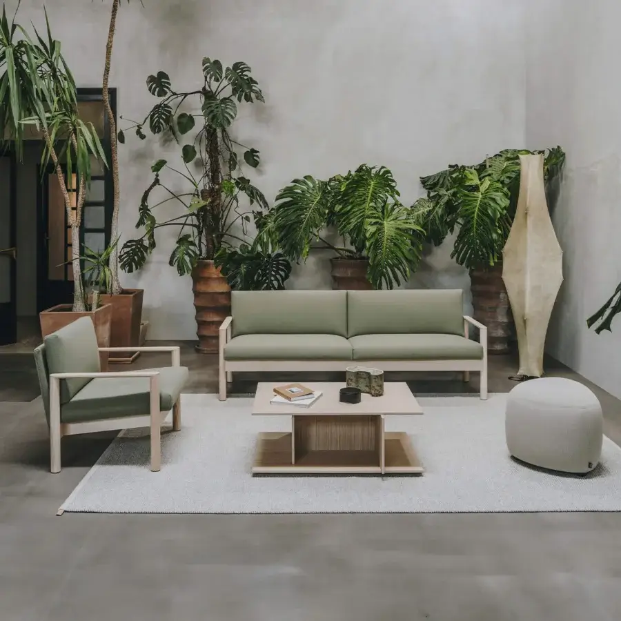 Architectural Lapalma 10:30 lounge chair with soft muted green textile and smooth satin wood finish
