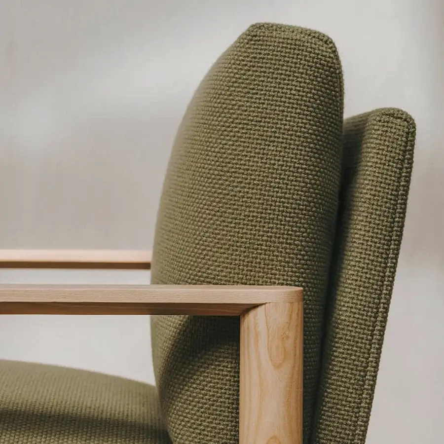 Distinguished Lapalma 10:30 lounge chair with textured olive green textile and solid ash wood frame