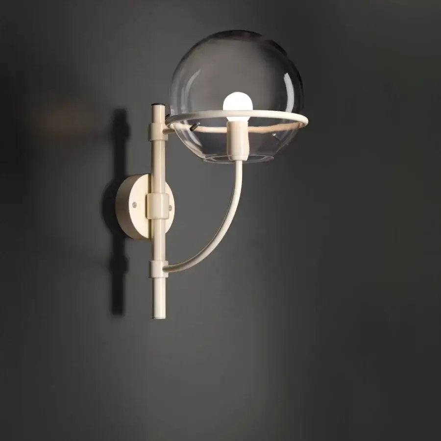 Distinguished Oluce Lyndon wall lamp with a gently arcing form in transparent polycarbonate and satin-finish beige metal