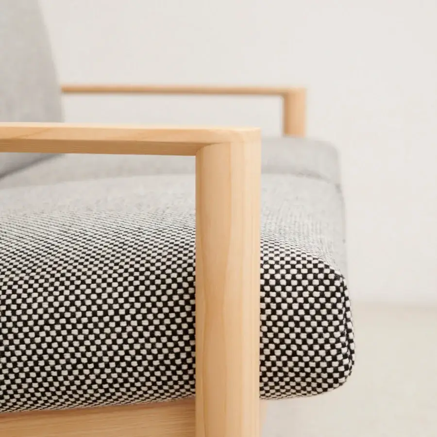 Architectural Lapalma 10:30 sofa crafted with solid ash and upholstered in black and white checked textile alongside solid gray