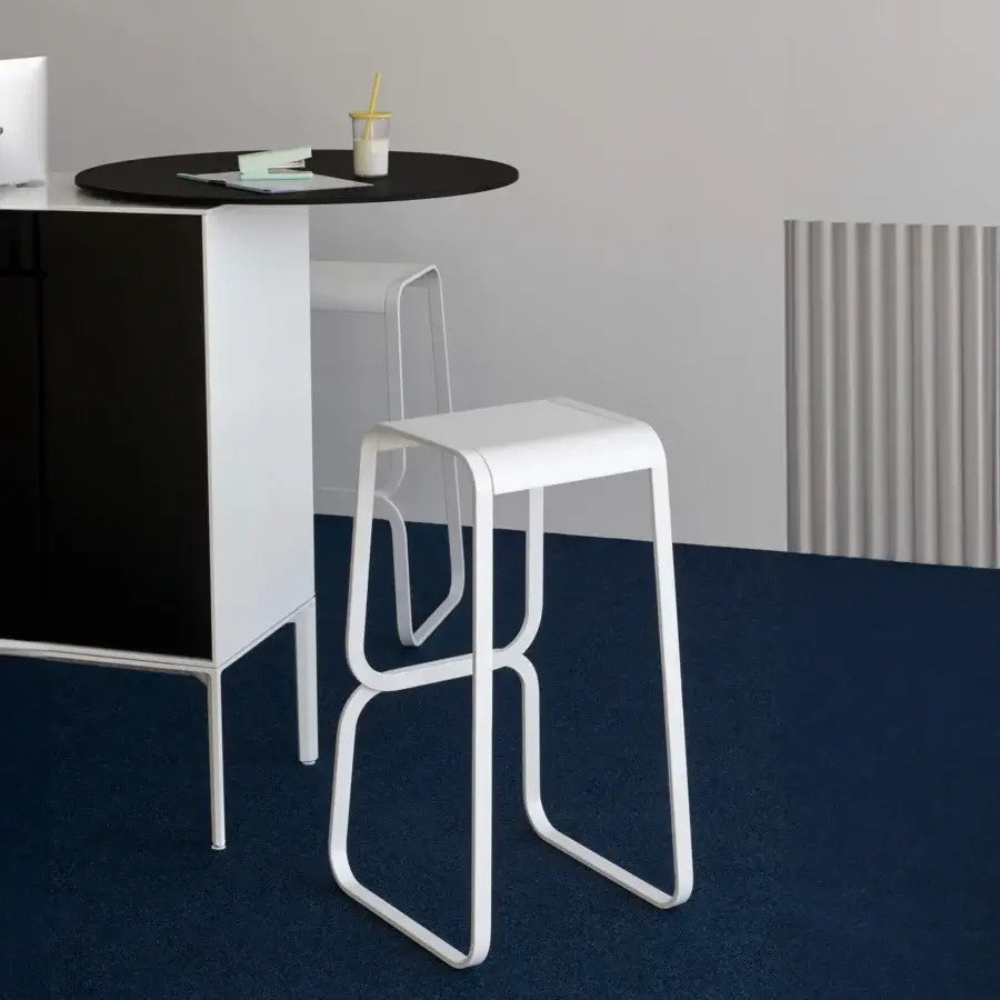 Innovative Lapalma Continuum stool with sculpted bent metal and smooth matte white finish