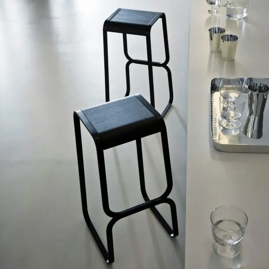 Exceptional Lapalma Continuum stool with sculpted bent metal and dark-toned wood exhibiting a subtle matte finish