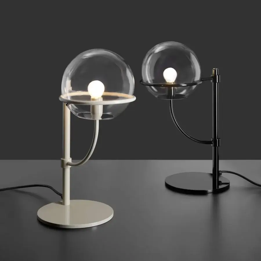Distinguished Oluce Lyndon table lamp with a sleek metal stem and four transparent polycarbonate spheres in a dark finish