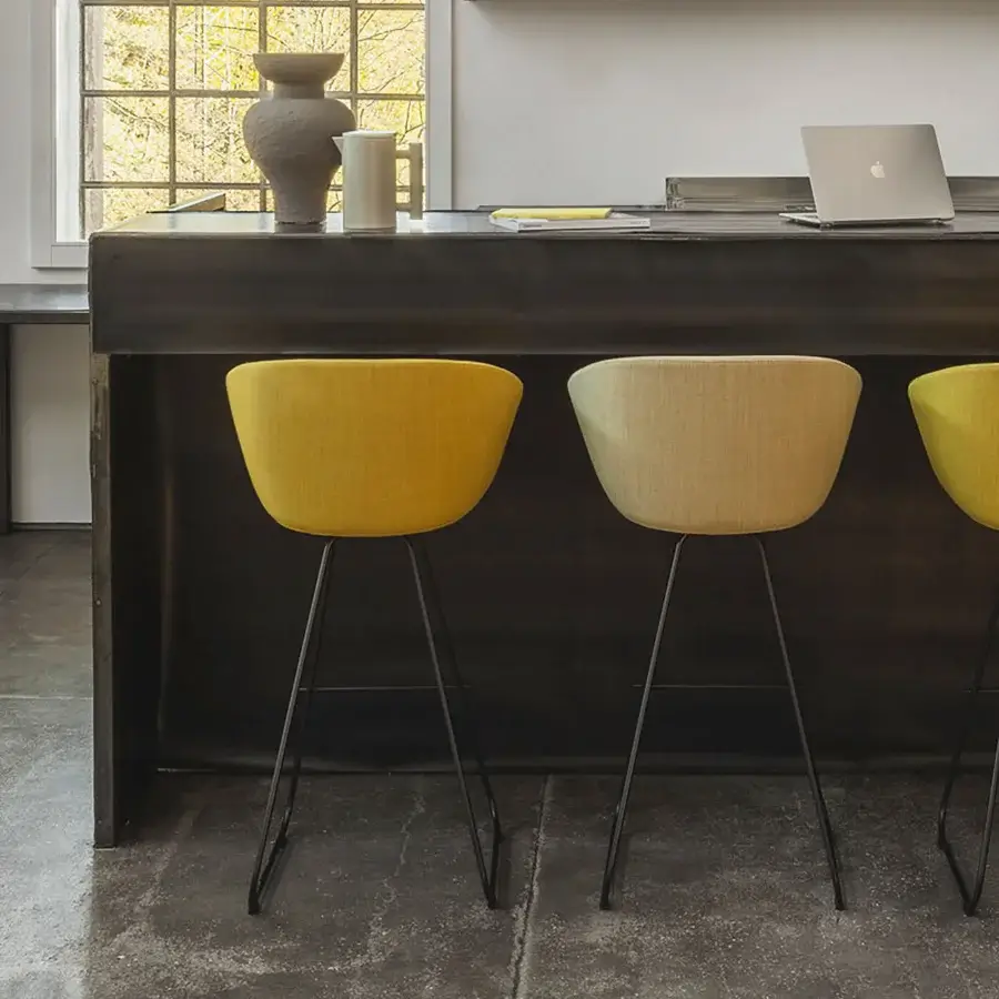 Harmonious Lapalma Glove stool upholstered in vibrant yellow textured textile with a sleek matte black metal base