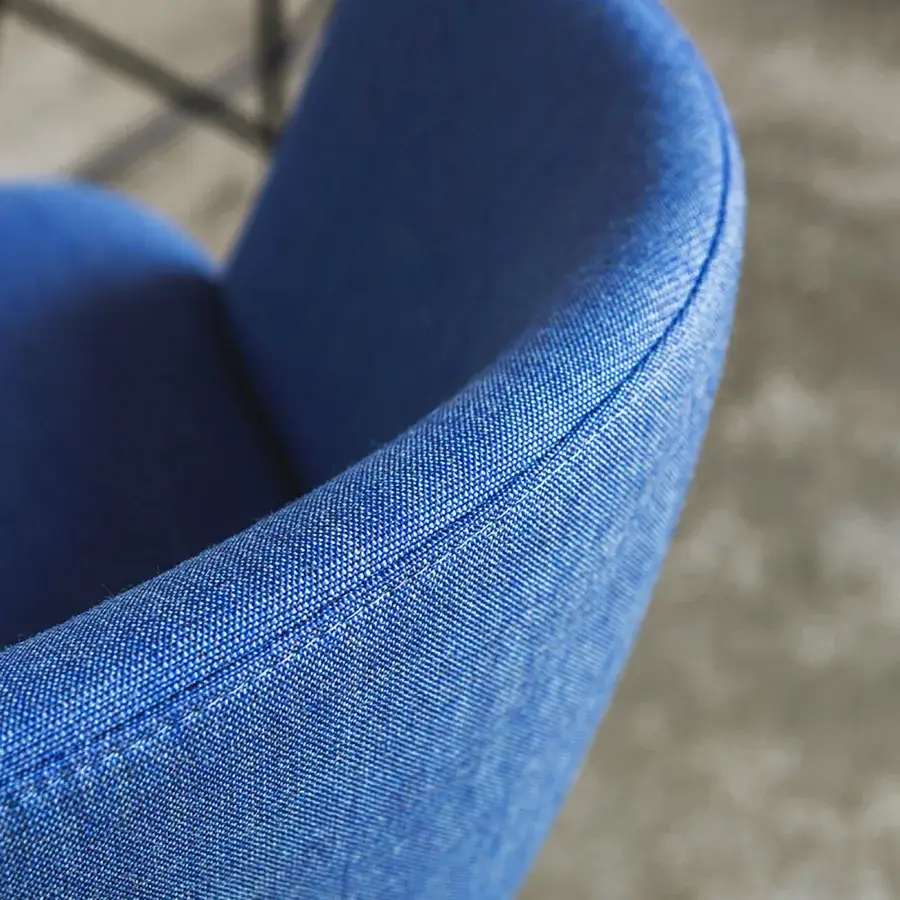 Harmonious Lapalma Glove stool upholstered in vibrant blue woven textile with a matte finish and enveloping form