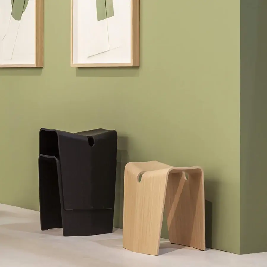Distinguished Lapalma Kami stool in bent plywood with smooth dark finish presents ergonomic comfort and sculptural form