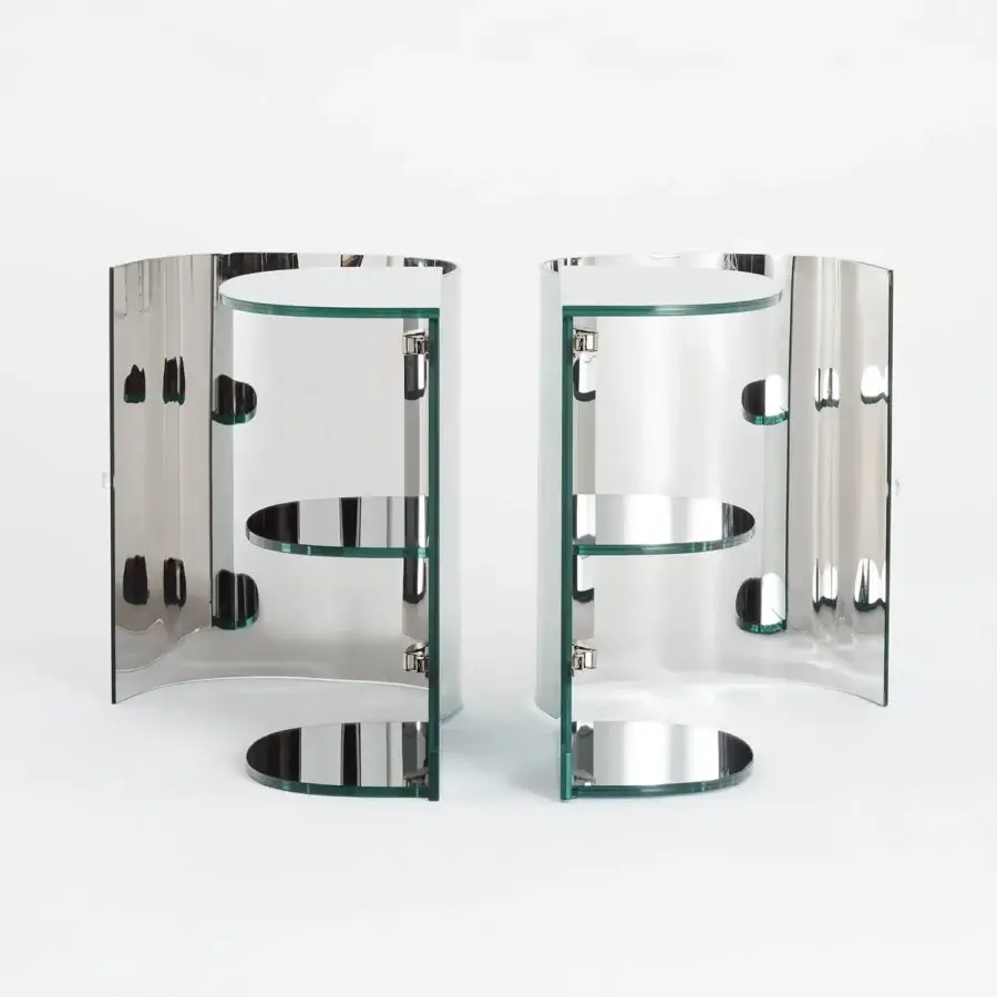 Elegant Glas Italia Oltralpe nightstand crafted in laminated and curved tempered mirrored glass with polished metal supports