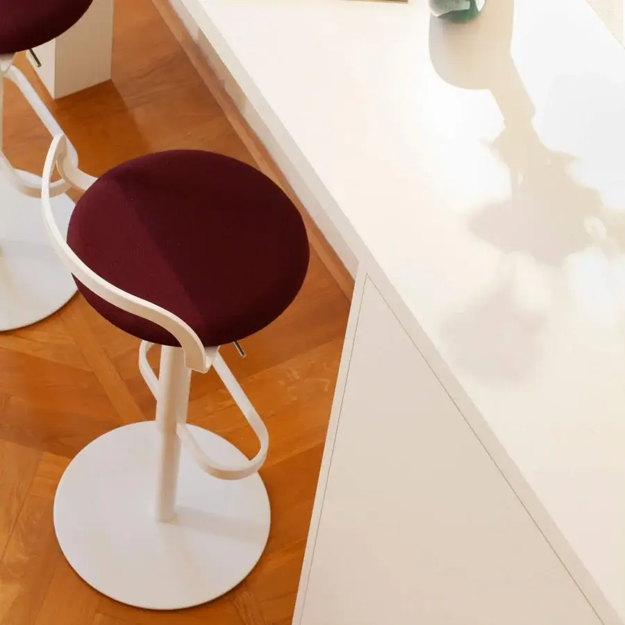 Distinguished Lapalma Mak stool in deep burgundy textured textile with bright white matte plastic base and sleek metal column