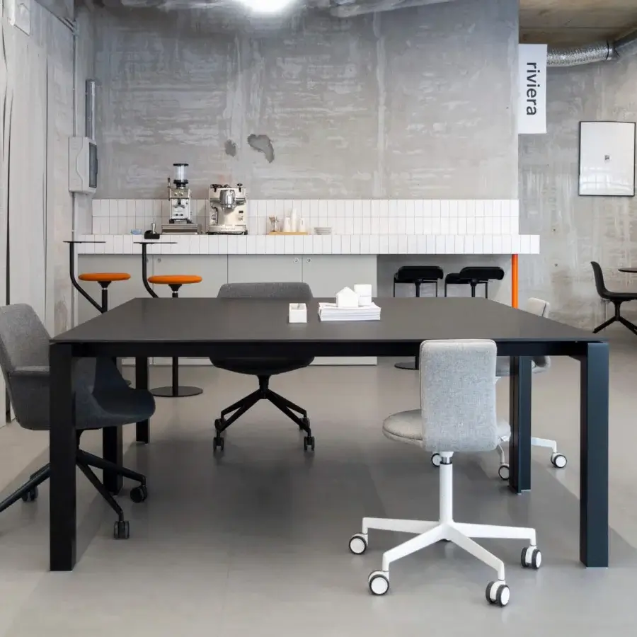 Distinguished Lapalma Apta table built with dark-toned tabletop and sleek matte black metal legs for collaborative spaces