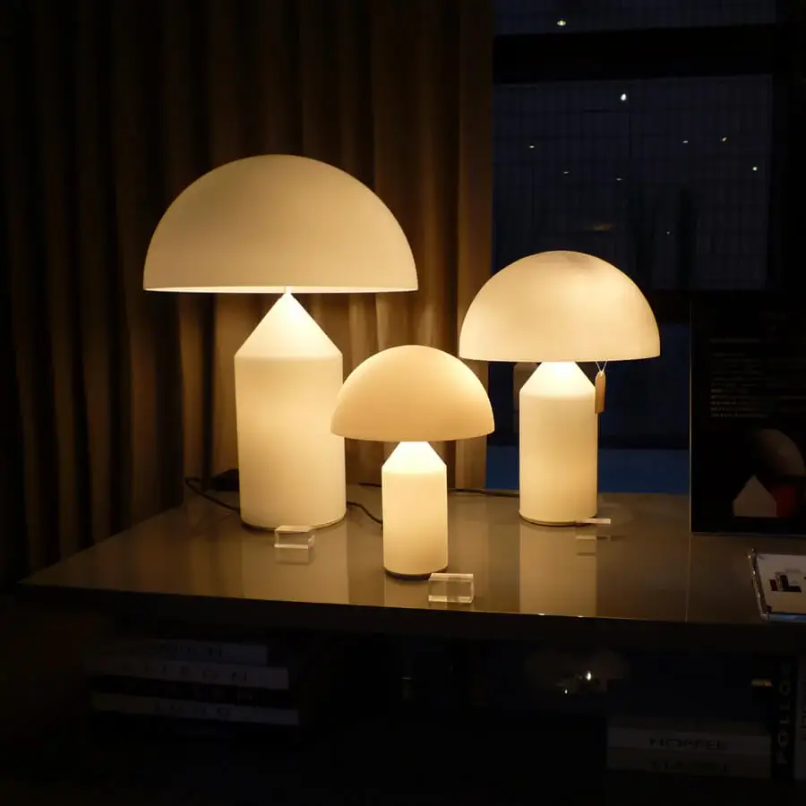 Distinguished Oluce Atollo Glass Lamp crafted in creamy white opaque glass with a polished silver-toned metallic base and satin finish