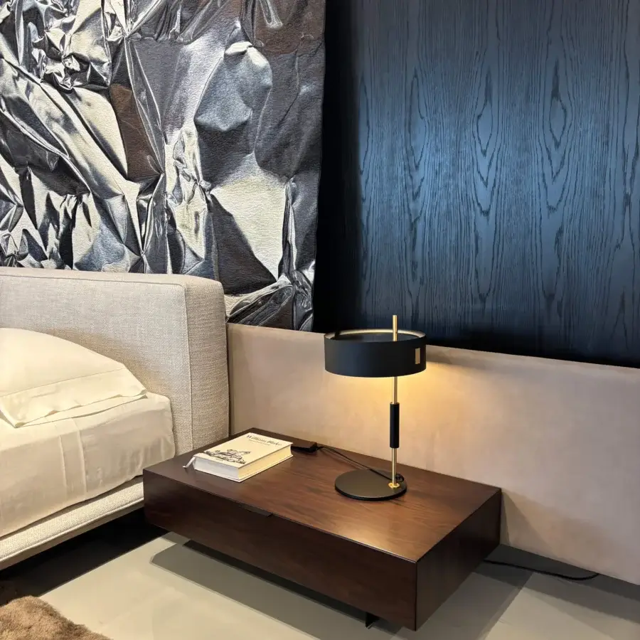 Distinguished Oluce 1953 lamp crafted in muted gold-tone polished metal with a translucent glass shade embodying Italian elegance