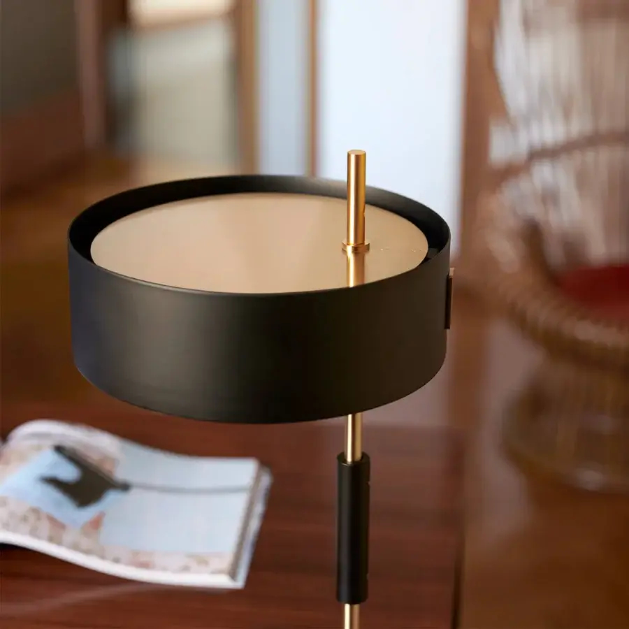 Refined Oluce 1953 lamp crafted in polished gold-tone metal with a translucent glass cylindrical shade
