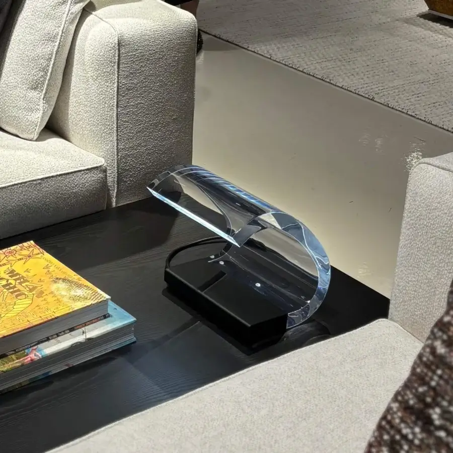 Distinguished Oluce Acrilica table lamp crafted in thick curved methacrylate and painted steel with glossy finish